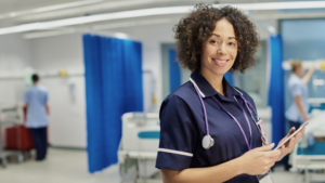 Nurse smiling at camera NHS