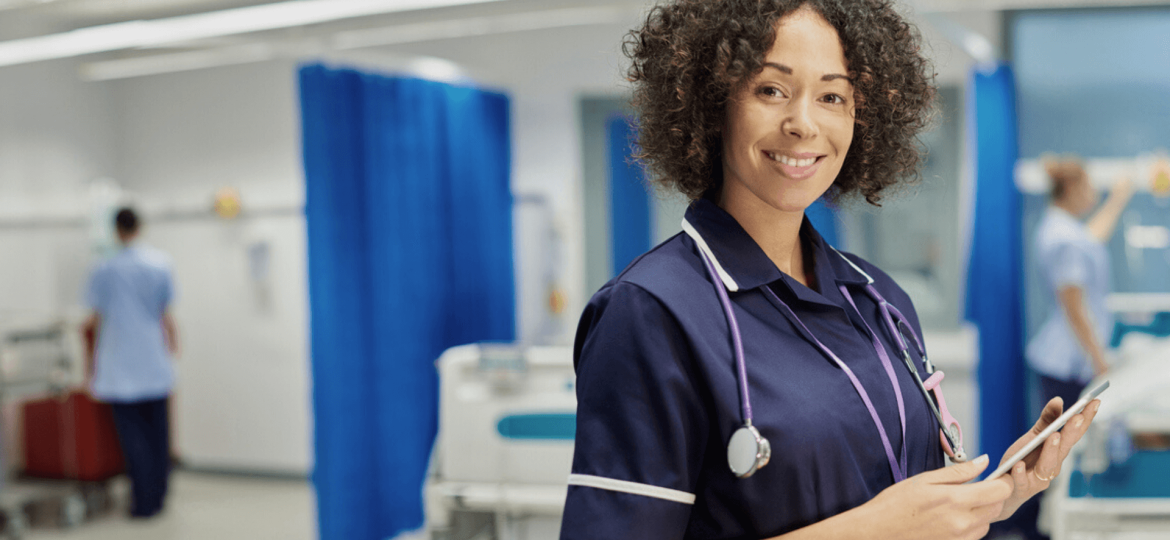 Nurse smiling at camera NHS