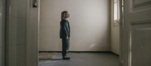 Boy looking at door