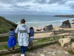 Mum with two children looking out to sea