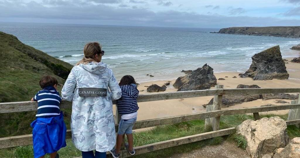 Mum with two children looking out to sea